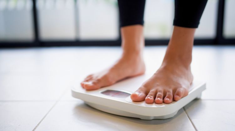 woman standing on scale