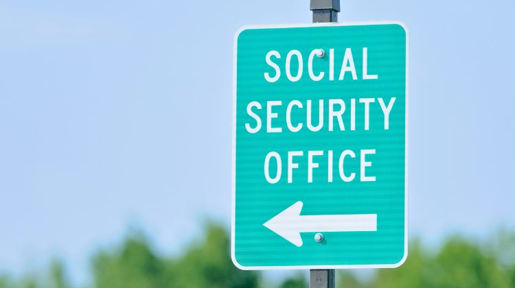 street sign giving directions to social security office