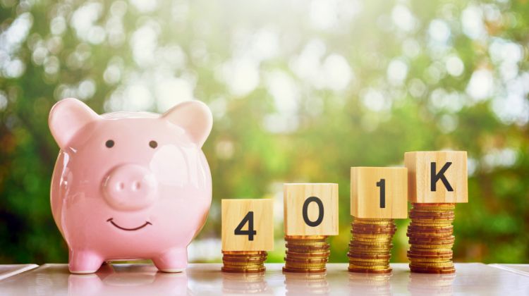Piggy bank next to a stack of coins that spell out 401k