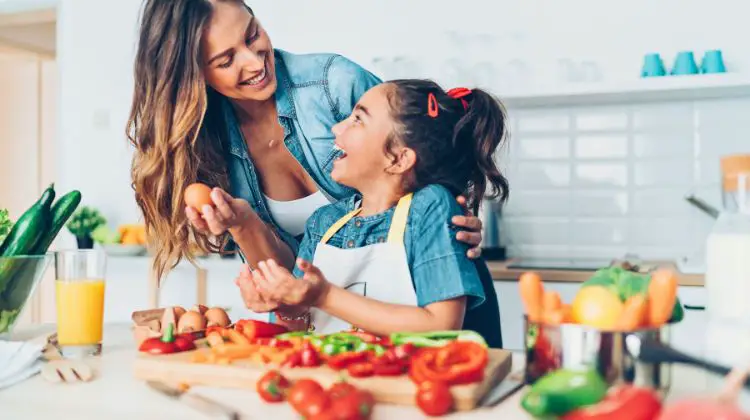 mother and daughter making a healthy meal together
