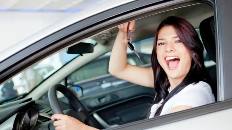 woman holding car keys