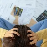 person struggling with personal debt and bills
