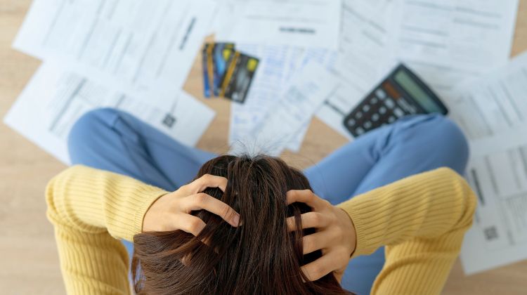 person struggling with personal debt and bills