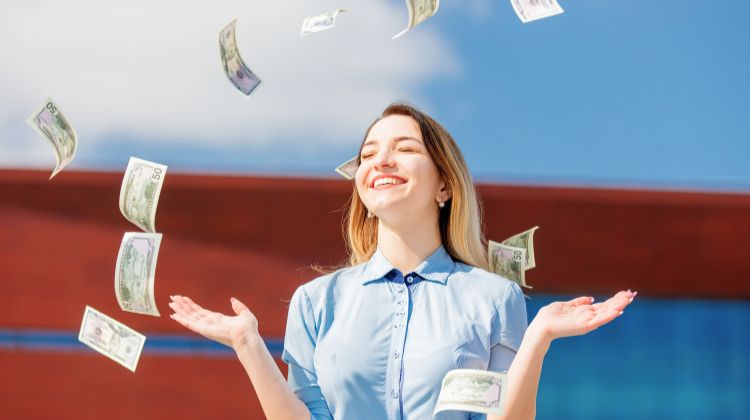 money raining on woman outside