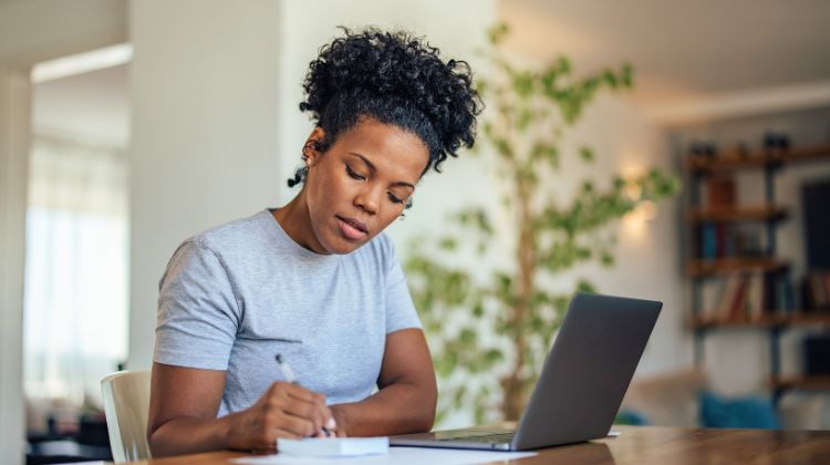 woman sitting at computer looking for job opportunities